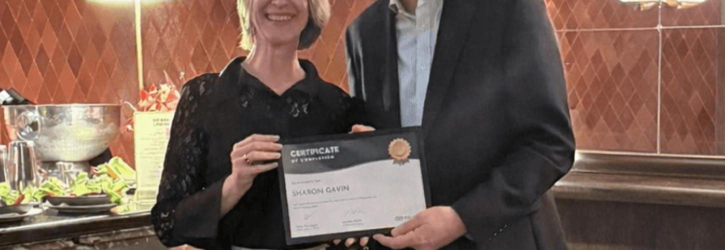 Simon Parrington presenting a certificate to Sharon Gavin