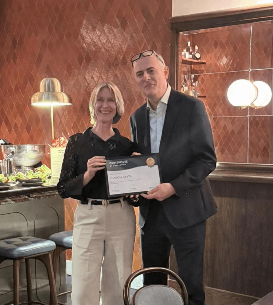 Simon Parrington presenting a certificate to Sharon Gavin