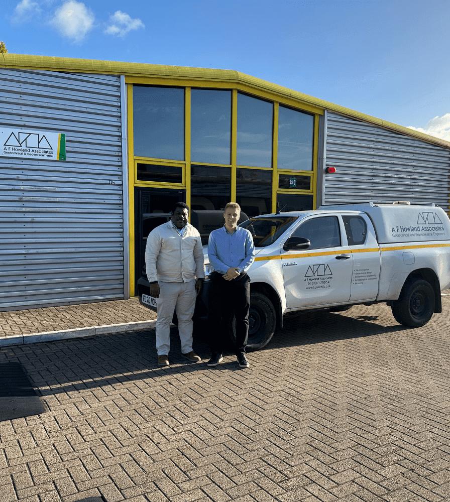 2 team members stood in front of the new AFHA london office